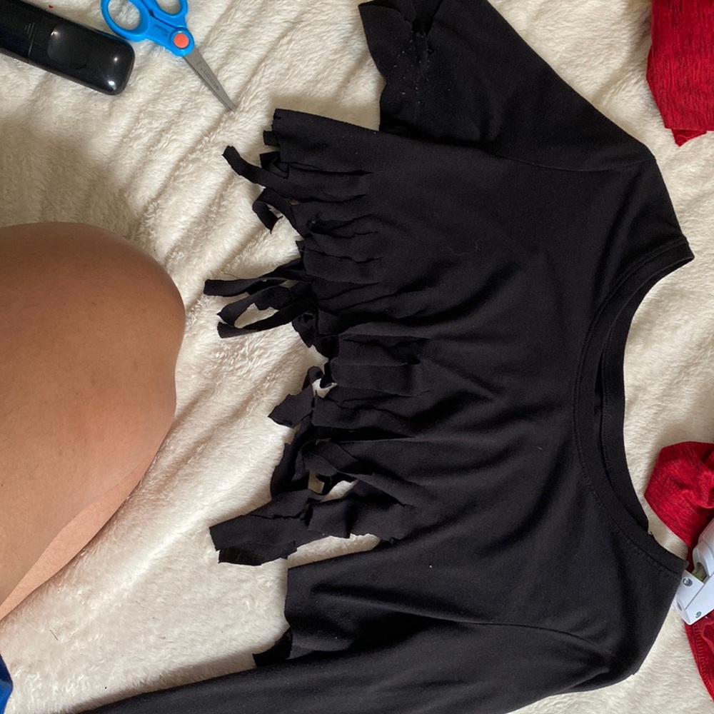 I’m selling a crop top with one sleeve short and the other one long, and strings